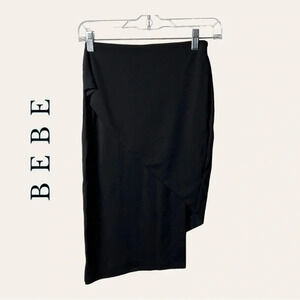 0224. BEBE ASYMMETRICAL WRAPPED MINI SKIRT BLACK IN COLOR SIZE‎ 2
